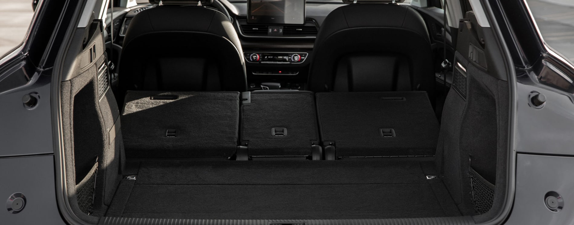 2023-Audi Q5 TFSI E -4.PNG A view of the cargo hold with back seats folded down in the 2023 Audi Q5 TFSI e
