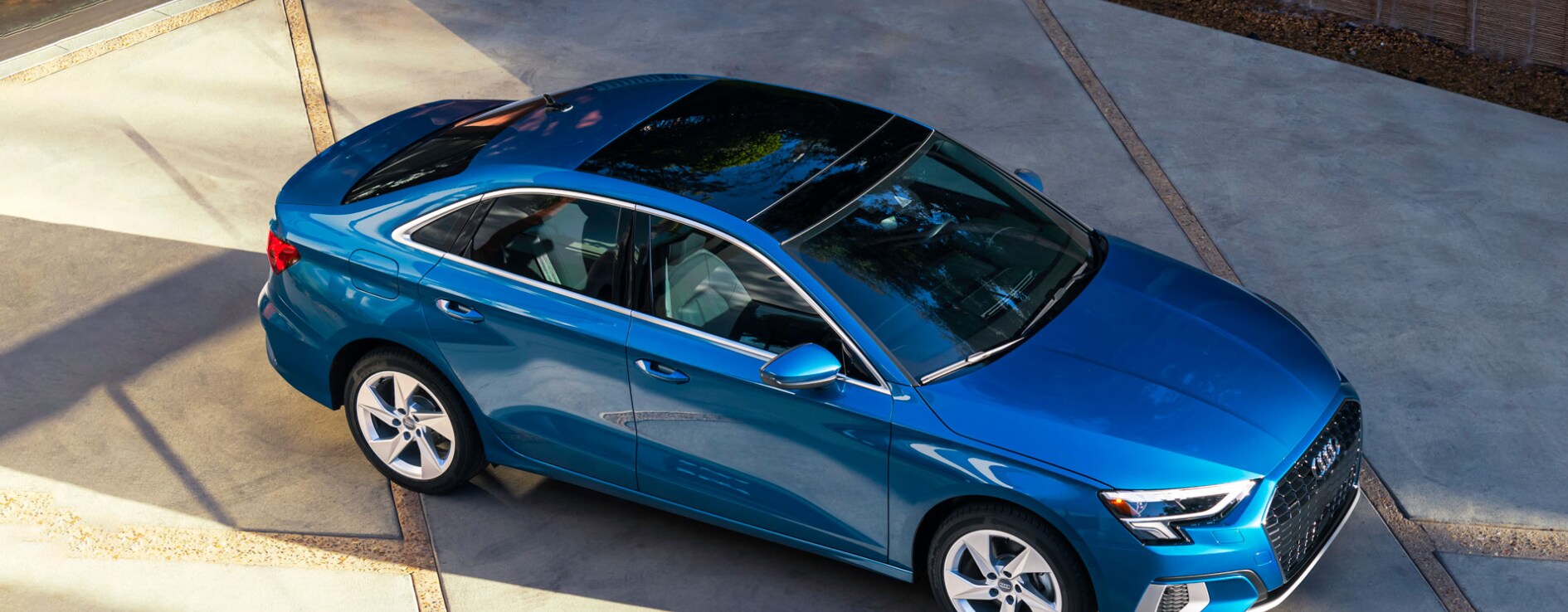 2023-audi-a3-4.PNG an-overhead-view-of-a-blue-2023-Audi-a3-sits-parked-on-a-concrete-driveway