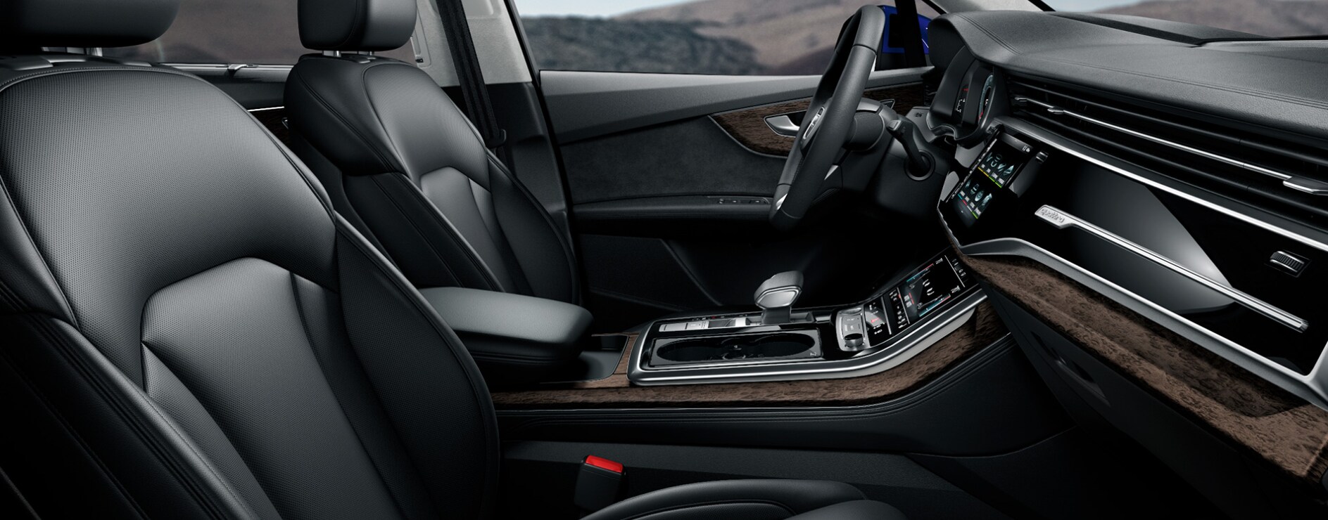2023-audi-q7-5.PNG A view of the interior dash and infotainment system of a 2023 Audi Q7