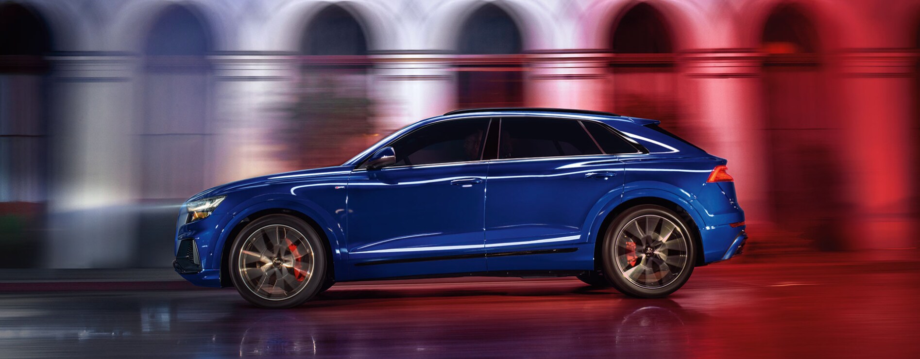2023-audi-Q8-1.PNG a profile view of an electric blue 2023 Audi Q8