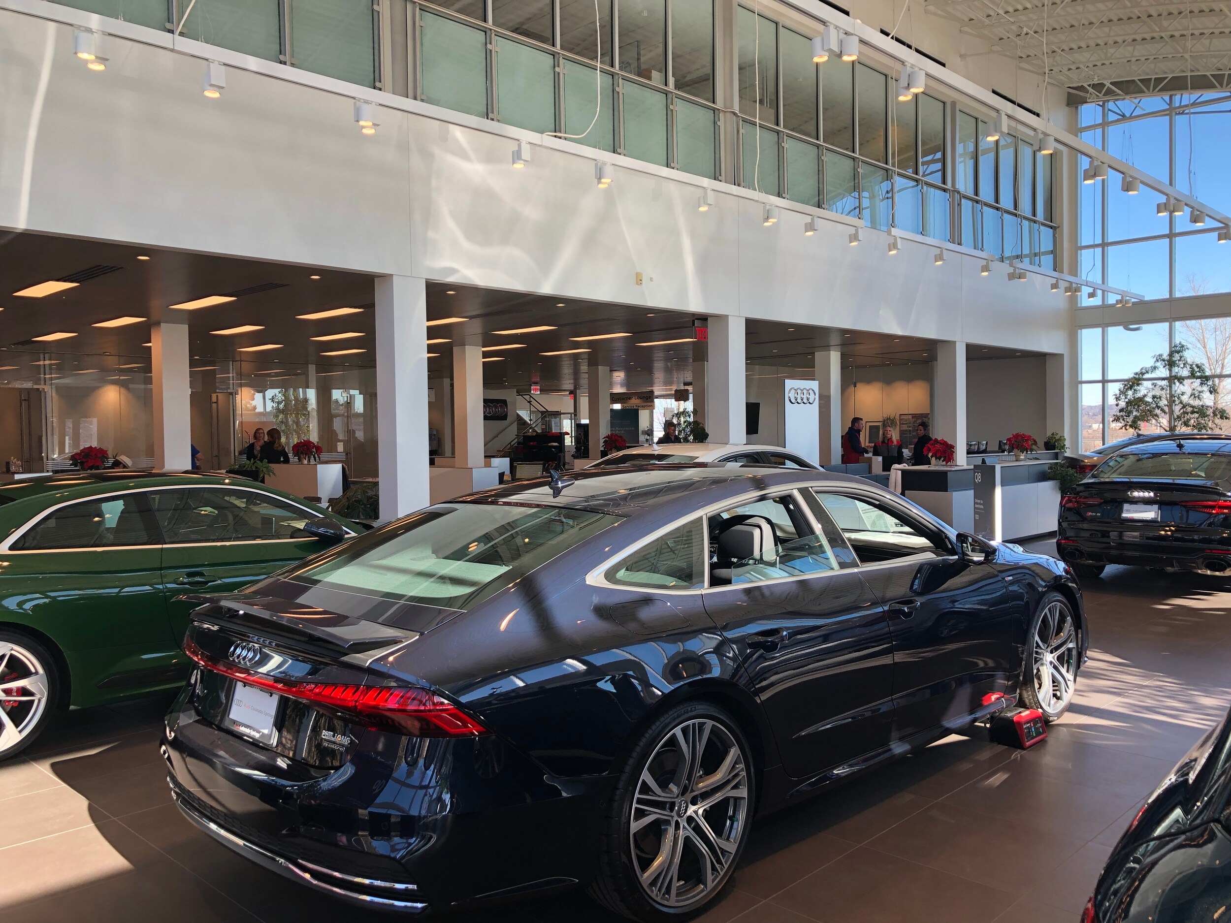 IMG_1377.jpg Back passenger side of a blue Audi sedan on the showroom floor of the Audi Colorado Springs dealership