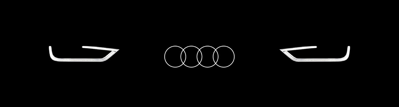 Audi Lease Return Center in Colorado Springs at Audi Colorado Springs.png Vector image of the outline of Audi headlights with an Audi logo in the middle