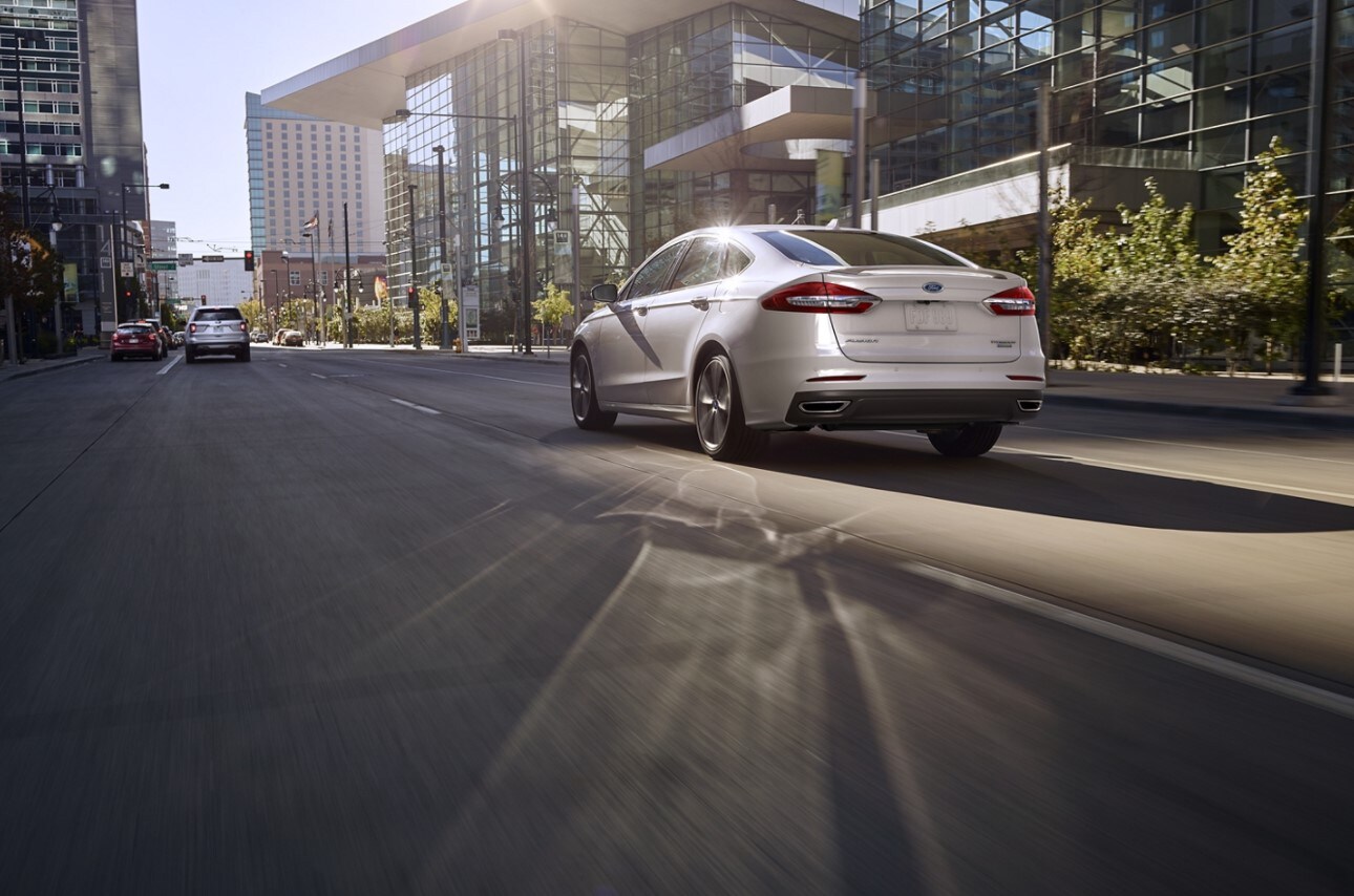 2020-ford-fusion-hybrid-03.jpg A new Ford Fusion Hybrid driving away