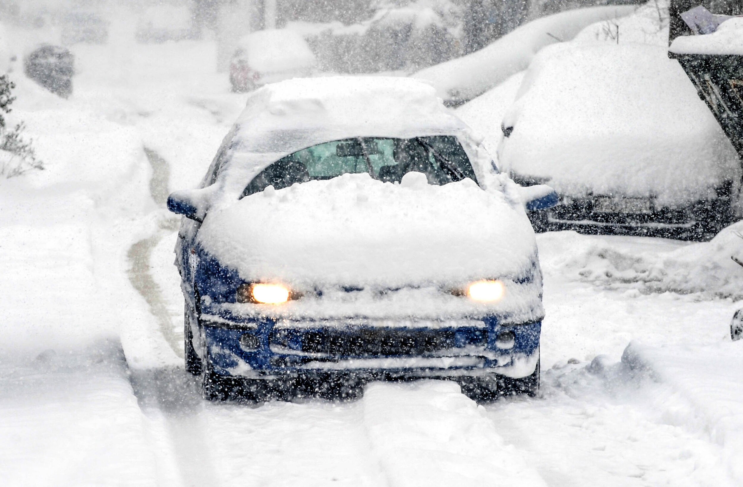 FWD%20Cars%20Snowy%20Car.jpeg Blue car covered in snow.