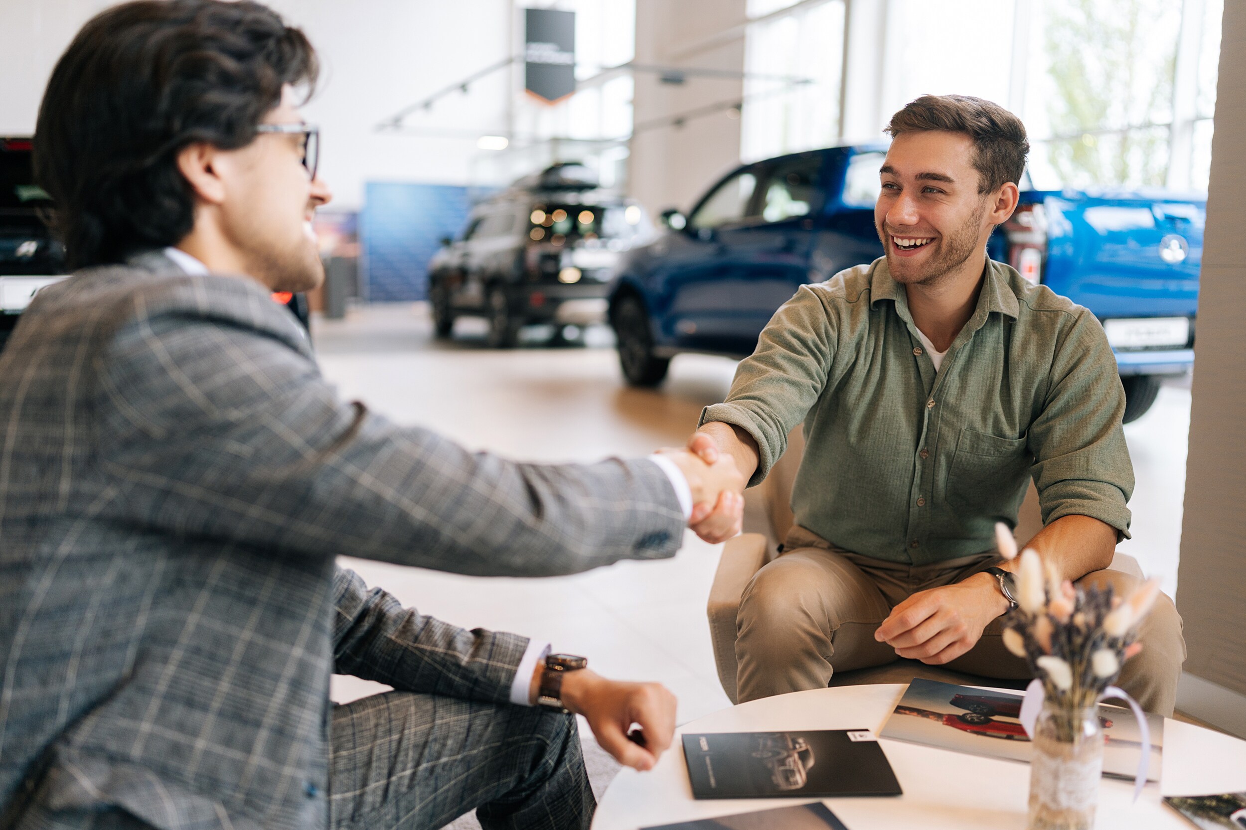 AdobeStock_668333381.jpeg A car salesman talking about a deal on a new vehicle.