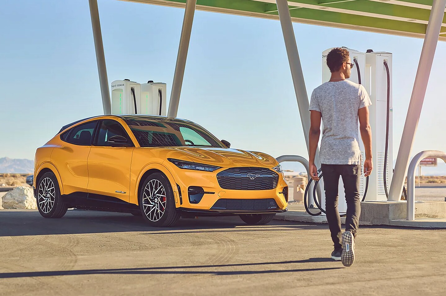 2022 Ford Mustang Mach E 3.png A 2022 Ford Mustang Mach-E at a BlueOval Charging station in a desert