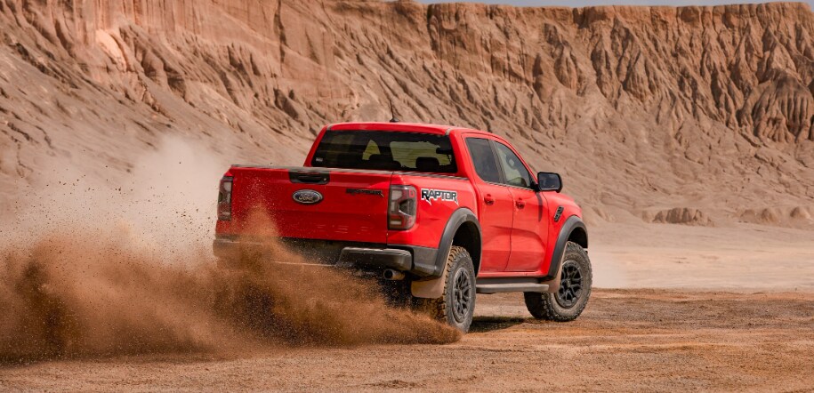 Ford Ranger Raptor 5.PNG new-ford-ranger-raptor-driving-through-sandy-terrain