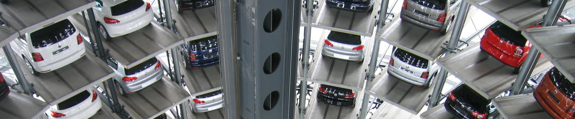Best used cars to buy in Colorado at Phil Long Dealerships.png Large cylindrical parking garage full of used cars showing stacked rows of many floors