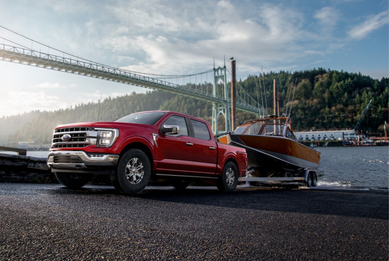 2021-ford-f150-18.jpg The all new Ford F-150 towing a boat near a bridge