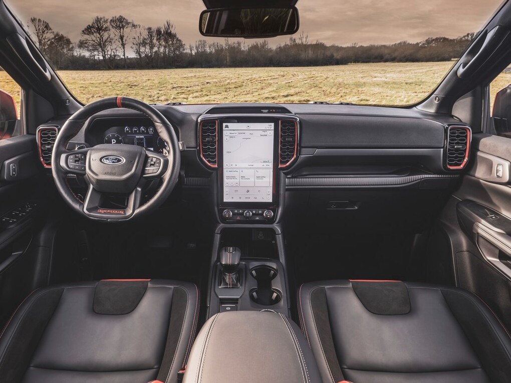 2022-Ford-Ranger-Raptor-3.PNG The interior of a Ranger Raptor, displaying the two front seats, dashboard, and infotainment system.