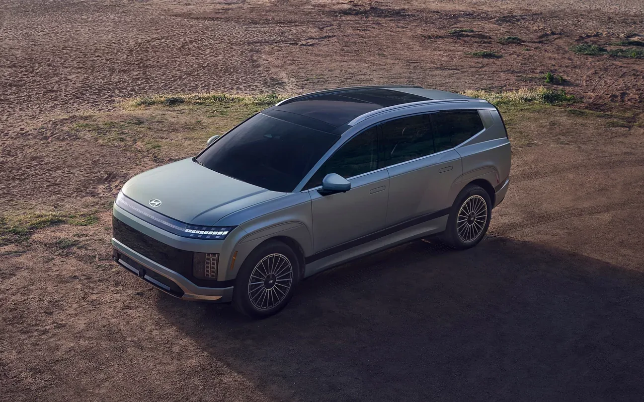 Aerial view of a 2026 Hyundai Ioniq 9 three-row electric SUV with pixel headlights and a panoramic roof