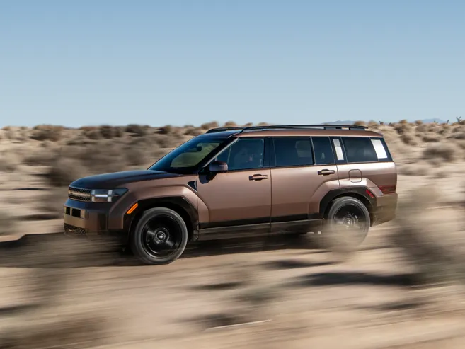 2027 Hyundai Santa Fe Hybrid tackling rugged terrain with HTRAC All-Wheel Drive for Colorado mountain driving