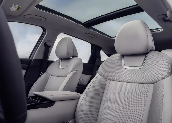 Spacious 2026 Hyundai Tucson Plug-In Hybrid Limited cabin with light gray seats and a panoramic sunroof
