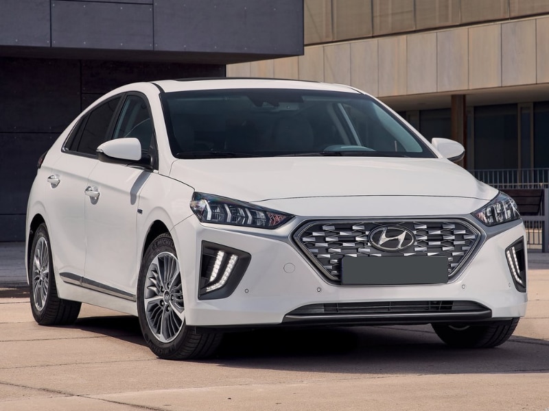 2020 Hyundai Ioniq hybrid / electric car white color parked modern industrial scene