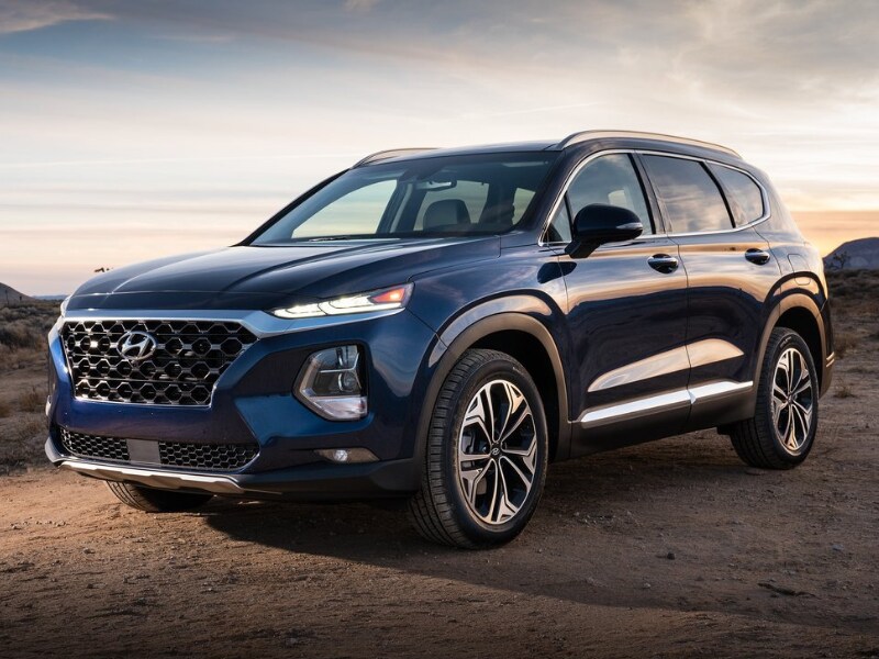 2020 Hyundai Santa Fe blue color dirt mountain path sunset scene
