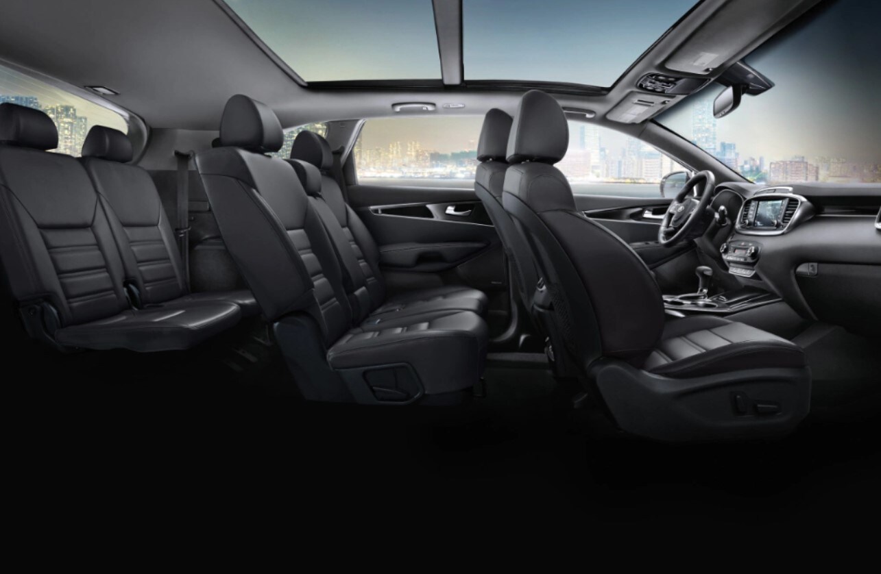 2020-kia-sorento-seating.jpg The dark interior seating of a 2020 Kia Sorento viewing all seating from the side profile
