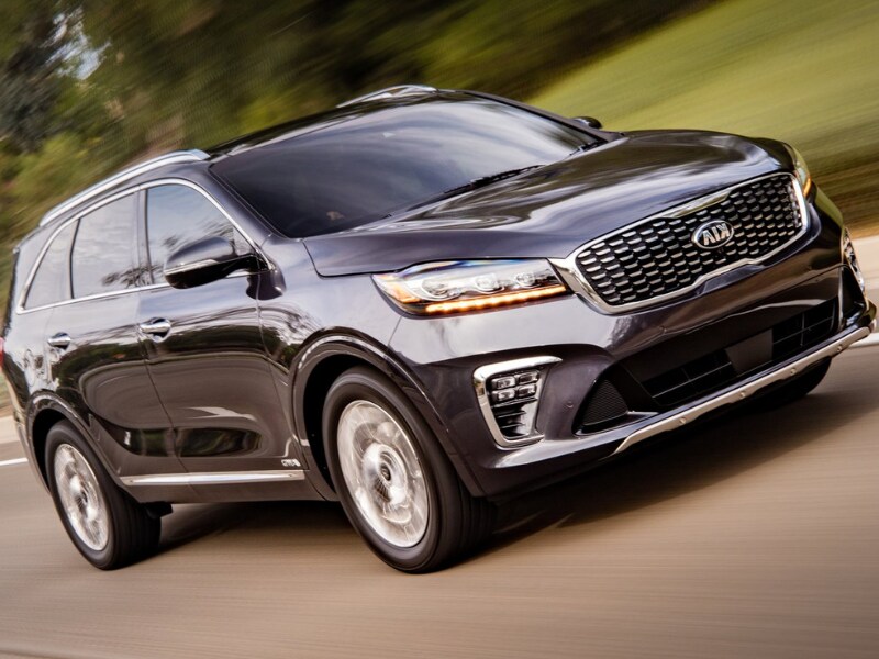 Front side exterior of a 2019 Kia Sorento driving down a street