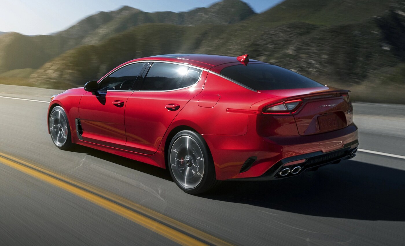 New 2021 Kia Stinger in Colorado Springs.png New 2021 Kia Stinger GT in red exterior color as it speeds away from the camera lens