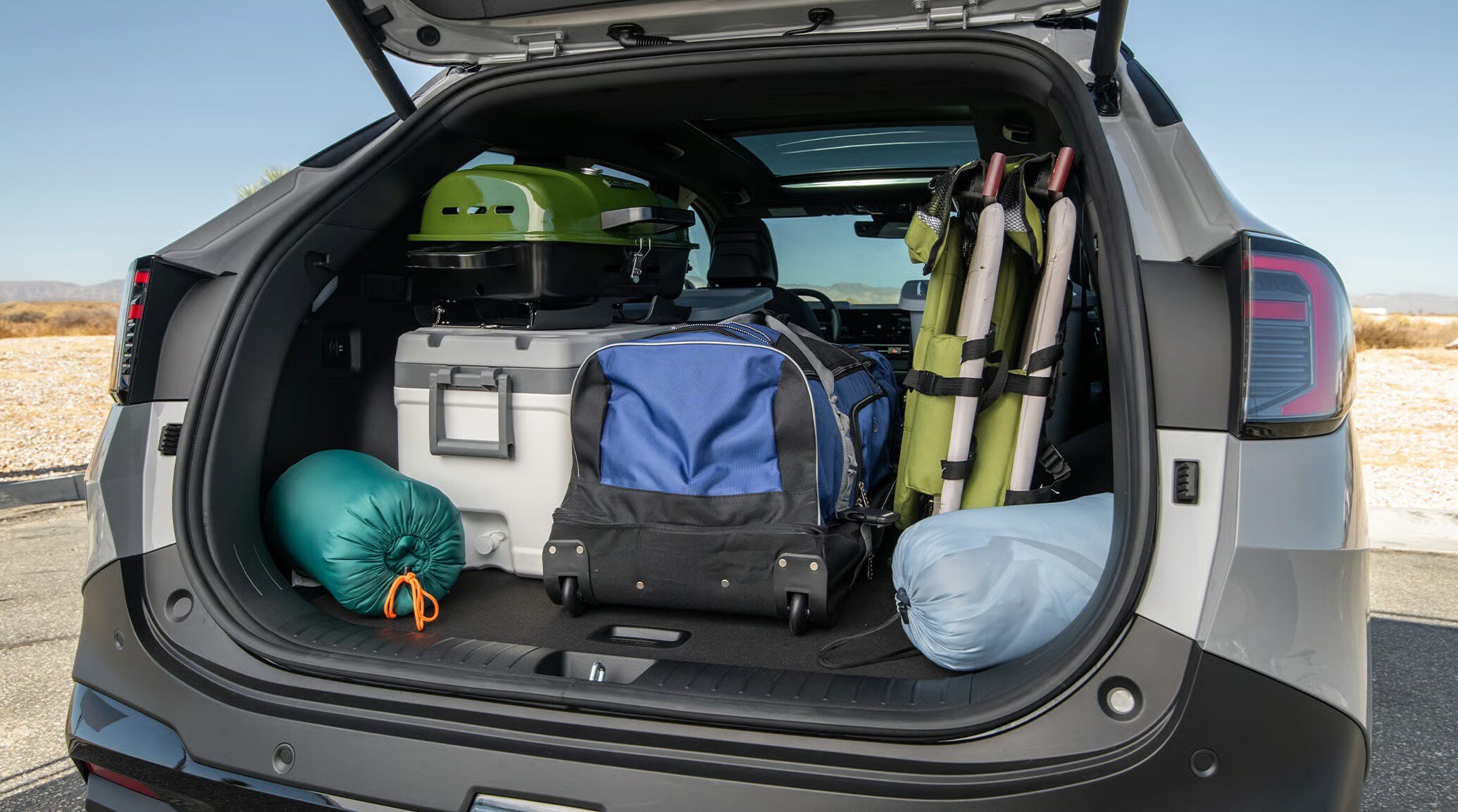 2026 Kia Sportage tailgate open and loaded with camping gear