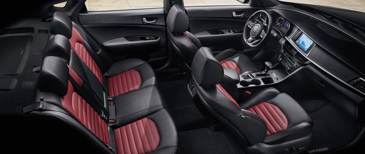 2020-kia-optima-interior-seating-phil-long-kia-colorado.jpg The black and red interior seating of a new 2020 Kia Optima