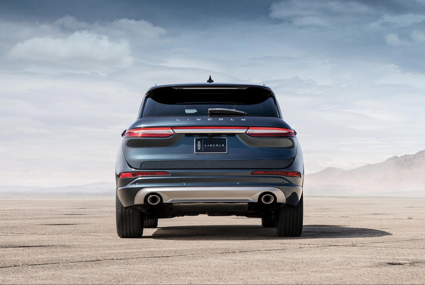 Lincoln Corsair Rear 1.png The Back end of an Ocean deep Blue 2022 Lincoln Corsair Parked