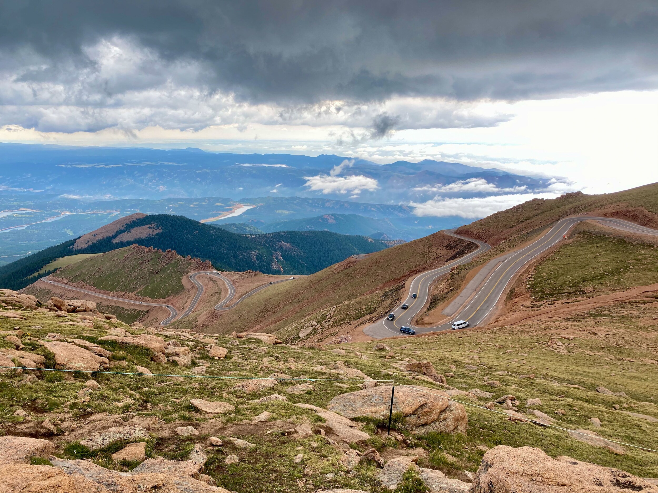 AdobeStock_895033919.jpg A view of the Pikes Peak highway as it rises above the tree line.