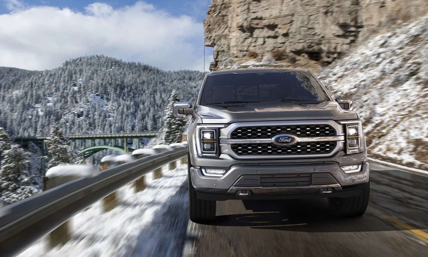 2021-ford-f150-23.jpg 2021 Ford F-150 driving alongside a mountain