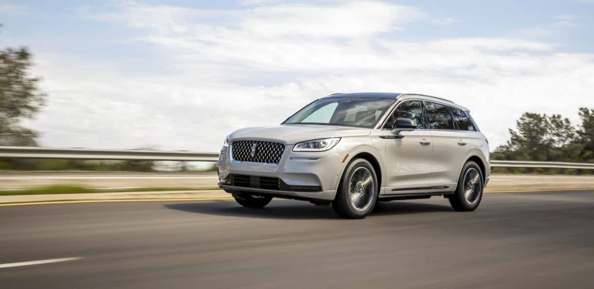 2022 Lincoln Corsair White 2022 Lincoln Corsair driving down the highway