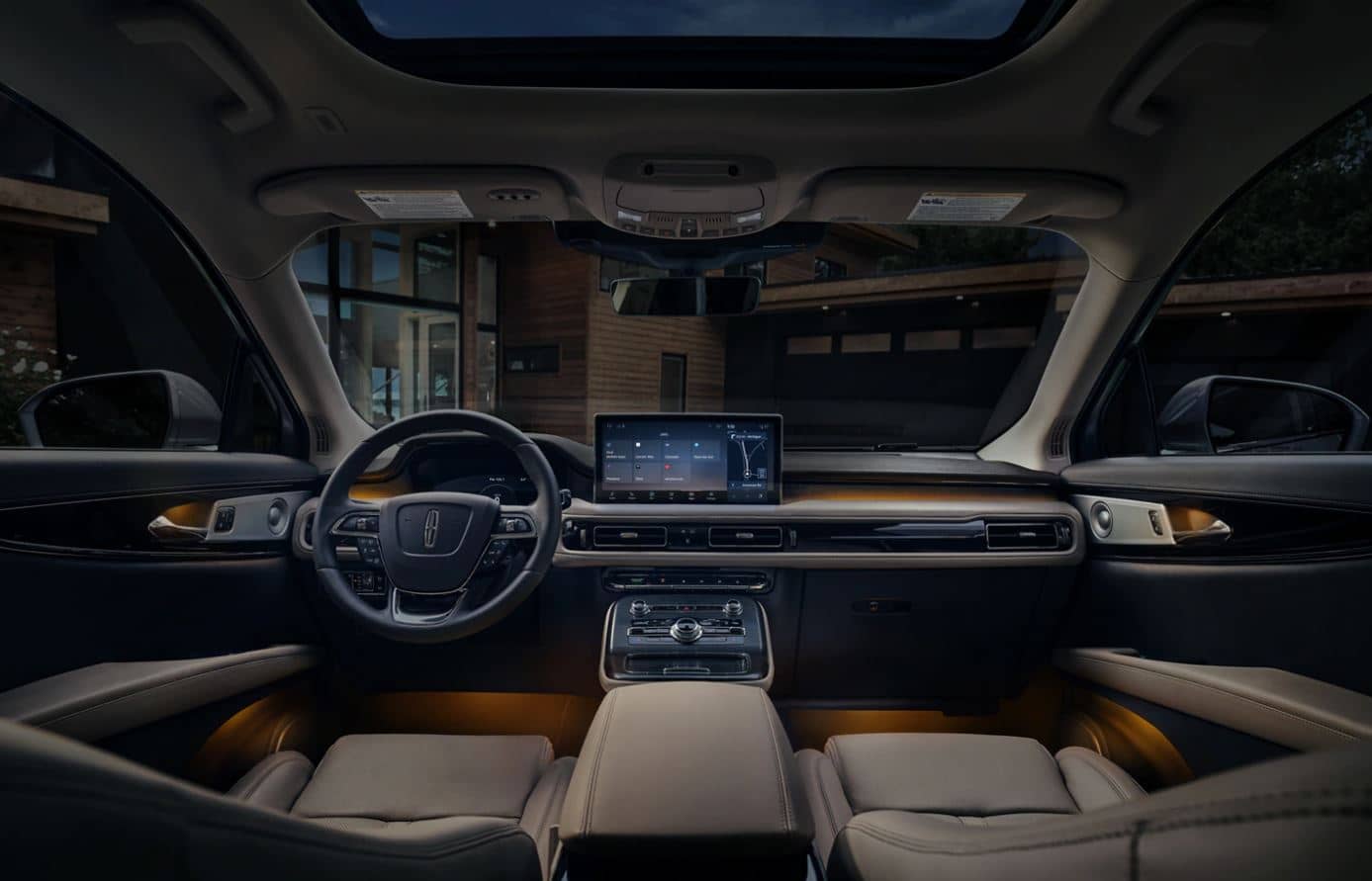 2022 Lincoln Nautilus Dashboard the dashboard of a 2022 Lincoln Nautilus parked in front of a house