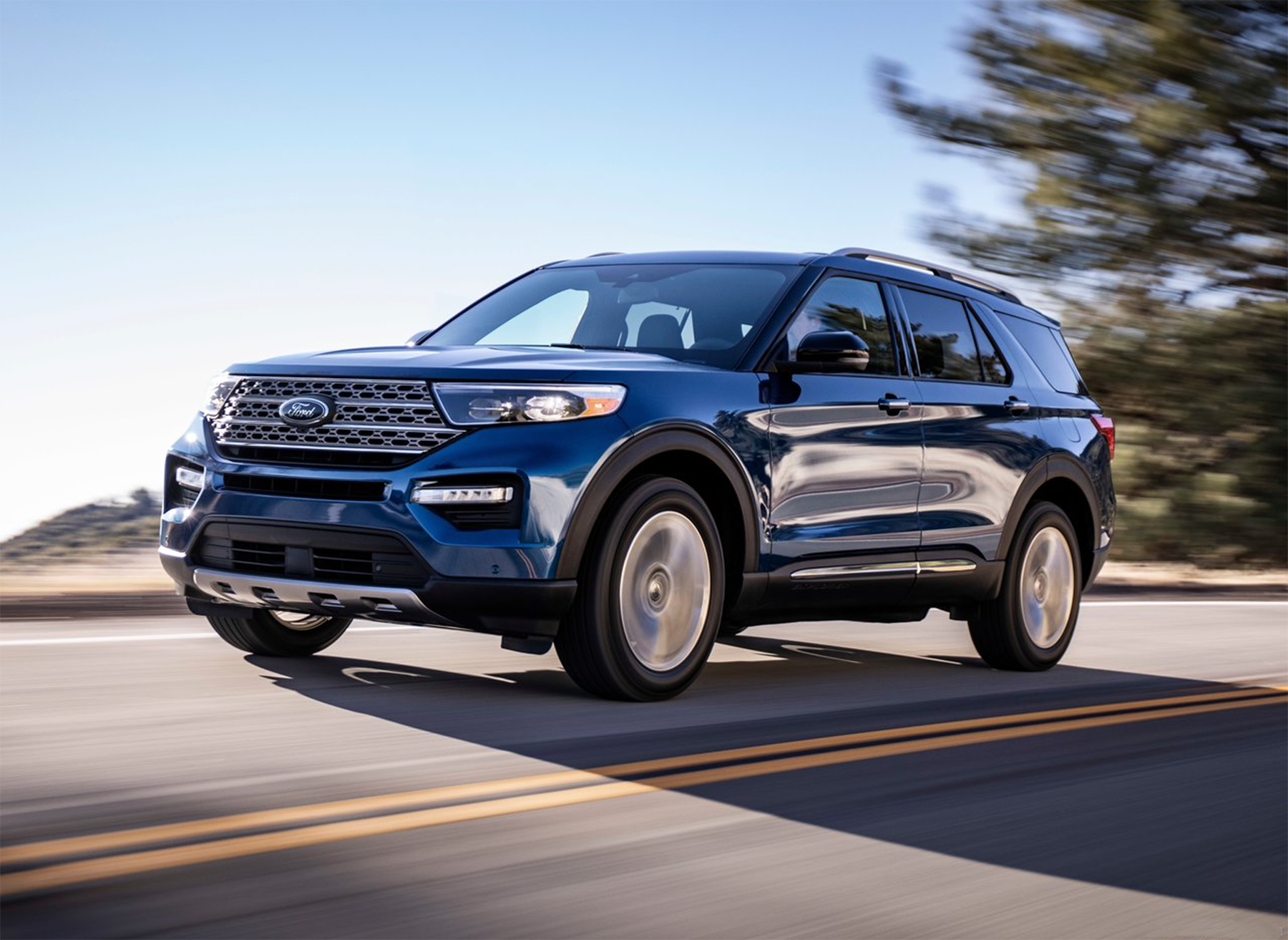 Ford%20Explorer%2024.png A Ford Explorer driving down a windy mountain road.