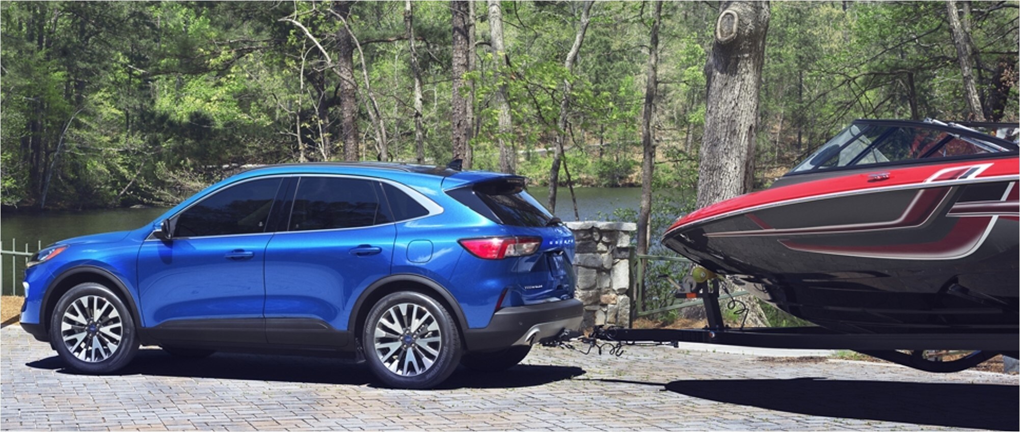 2020-ford-escape-towing-capacity-phil-long-ford-raton-ford-dealership-nm.jpg A 2020 Ford Escape pulling a sail boat
