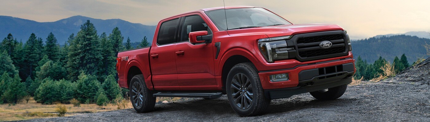 Ford F-150 Red Ford F-150 Lariat Truck parked on a rocky hillside