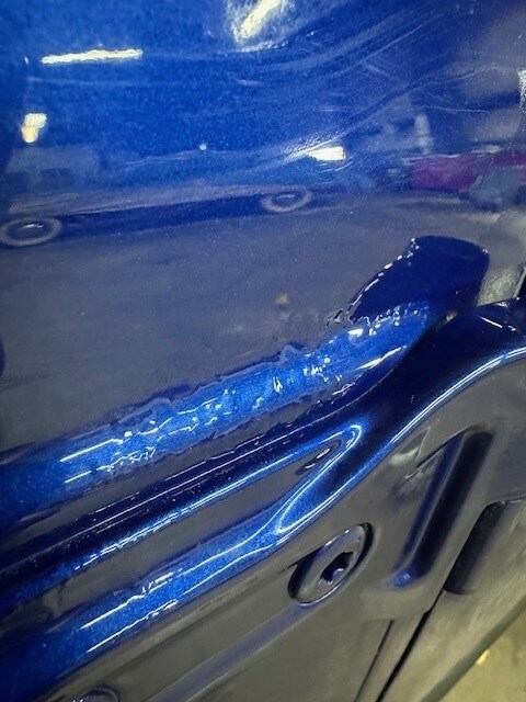Blue Jeep paint corrosion