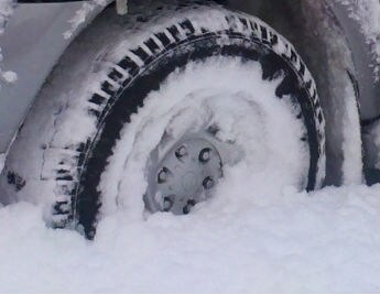 snow in Wheel Subaru Outback.jpg