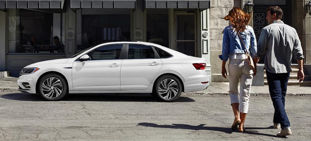 A-young-couple-walking-towards-their-new-VW-Jetta-SEL-Premium.jpg
