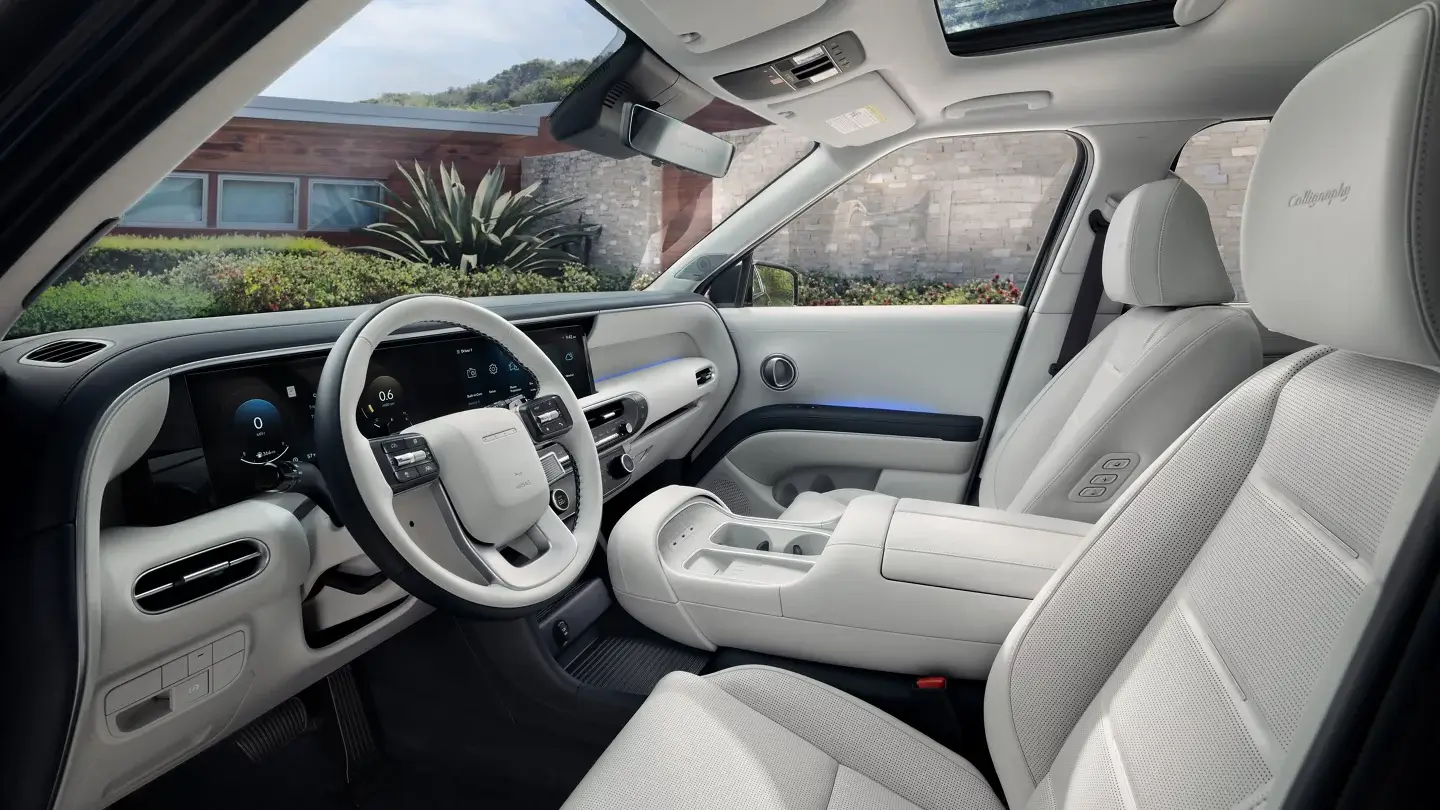 Calligraphy interior of a Hyundai Palisade with leather-trimmed seats and wood dashboard trim