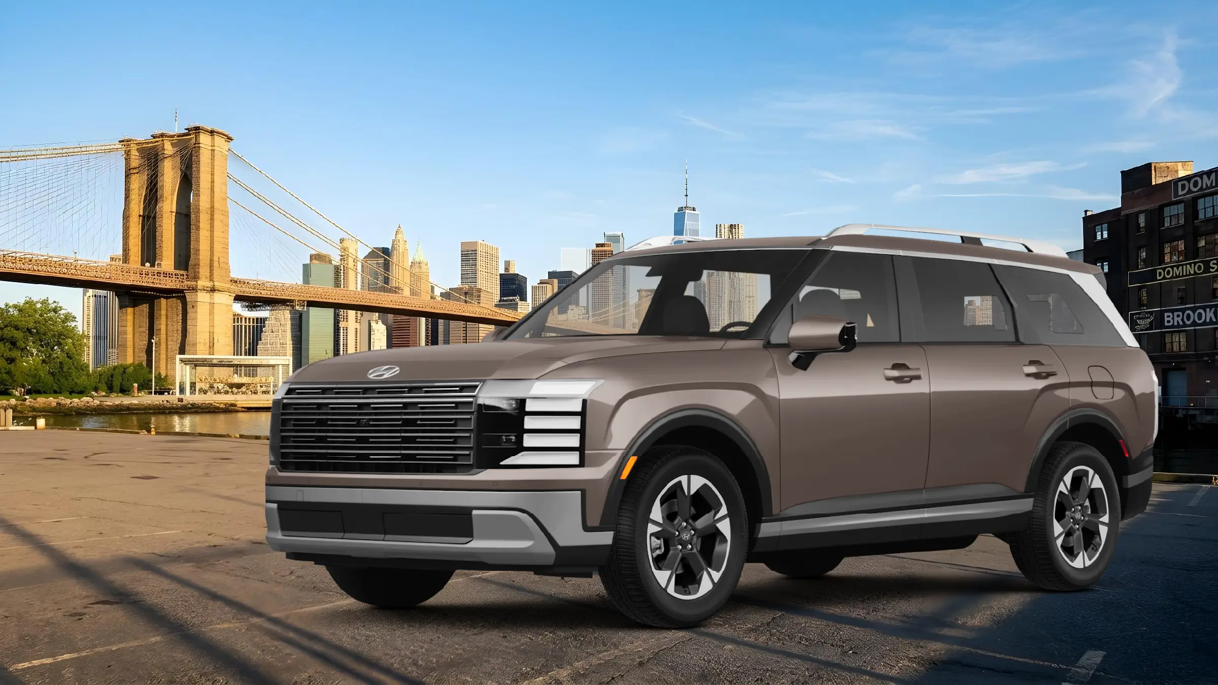 2027 Hyundai Palisade three-row SUV with the Brooklyn Bridge and the Manhattan skyline behind it