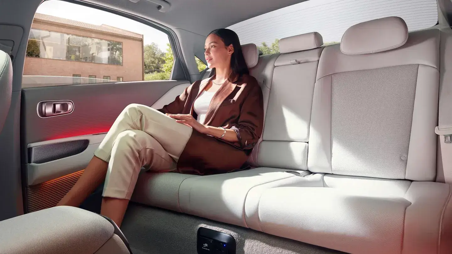 Passenger relaxing in the Hyundai Ioniq 6 rear seat
