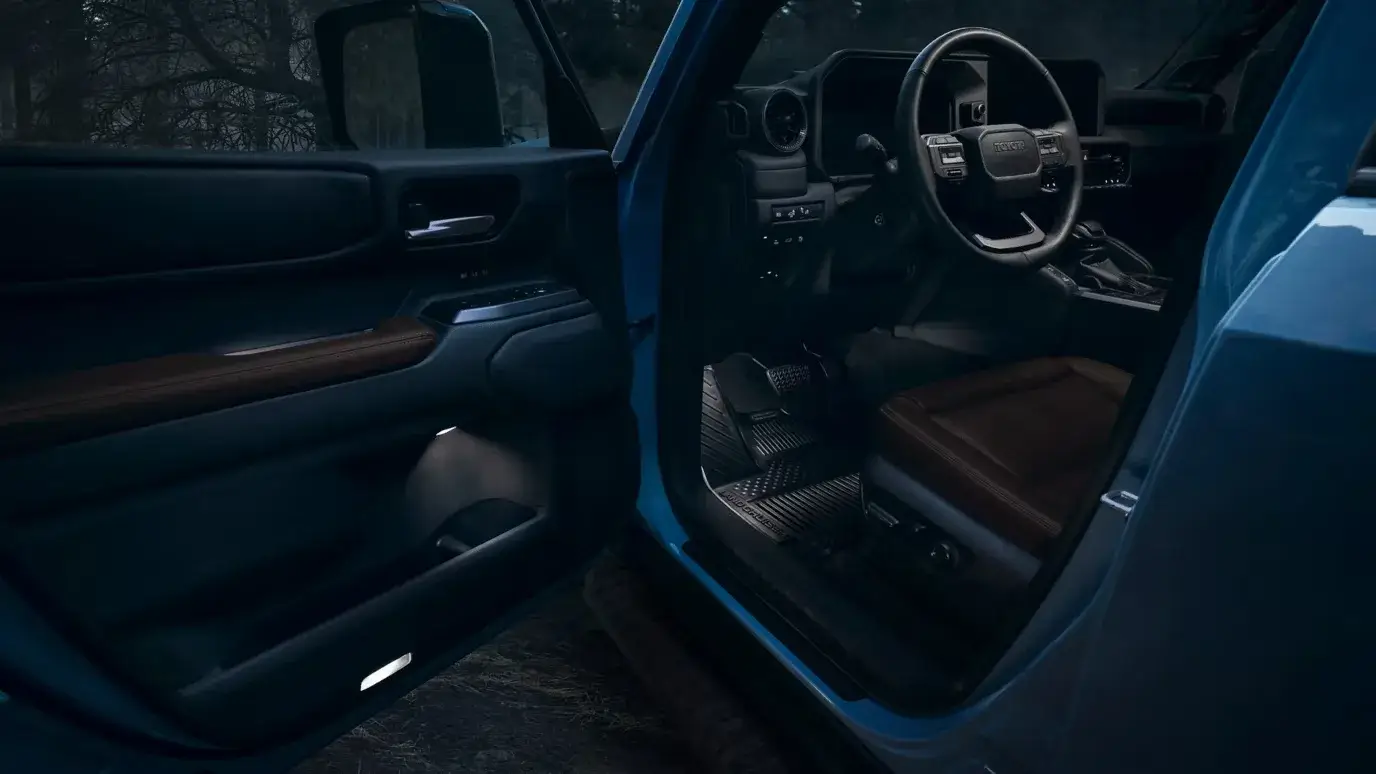 Driver's door open on the 2027 Toyota Land Cruiser showing the step-in height and cabin