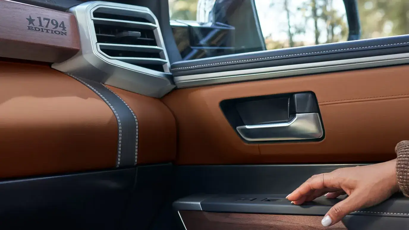 Toyota Tundra 1794 Edition passenger door with brown leather and wood-grain trim