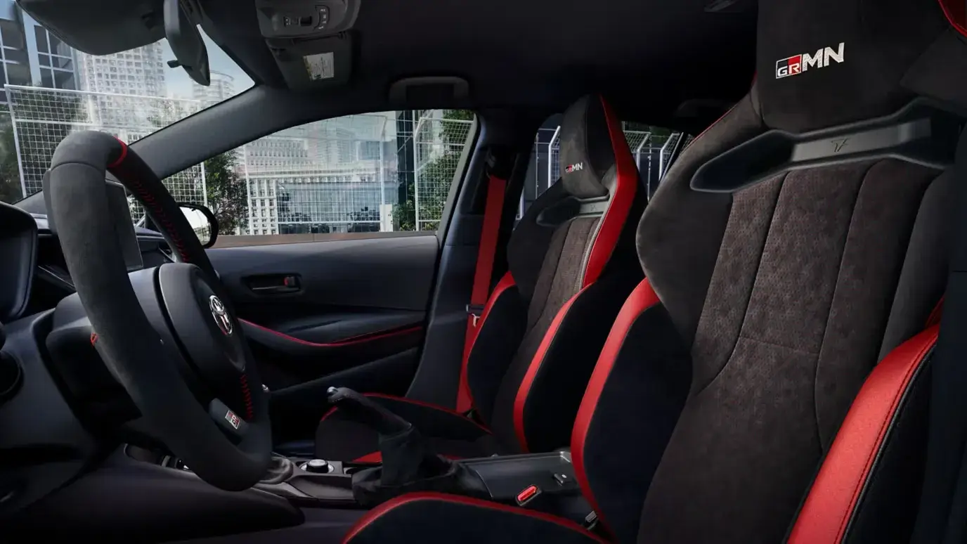Toyota GR Corolla front sport seats and interior trim with red stitching