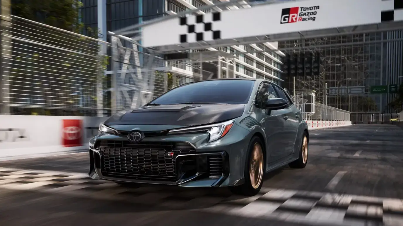 Toyota GR Corolla front three-quarter view showing the flared arches and GR-Four all-wheel drive stance