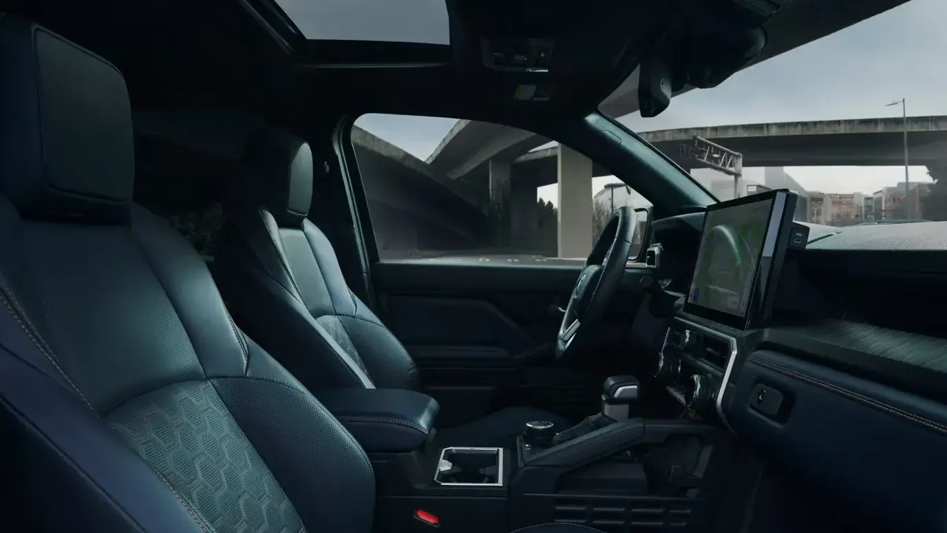 2027 Toyota 4Runner cabin viewed from the passenger side showing front seats and console
