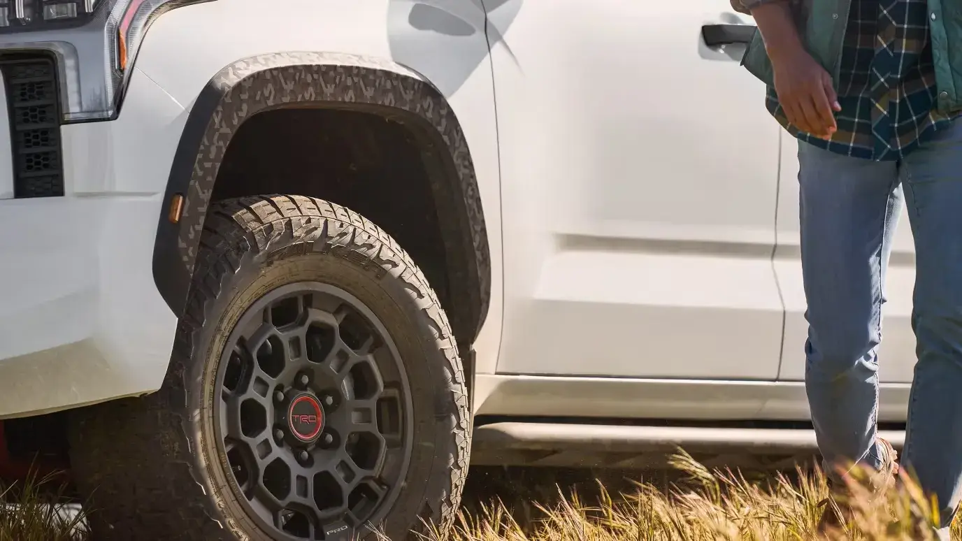 Toyota Tundra driving off-road on a dirt trail