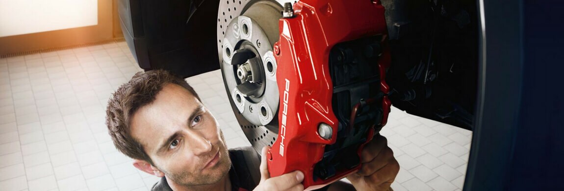Porsche Brake Service Porsche technician performing a brake service
