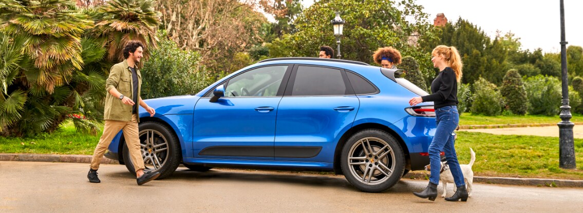 Blue Prosche Macan driver side view
