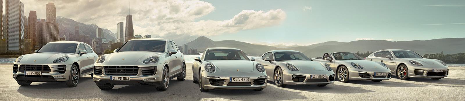 Porsche Towson is a Luxury Car Dealership near Hunt Valley MD | 2020 Porsche full vehicle lineup in front of city