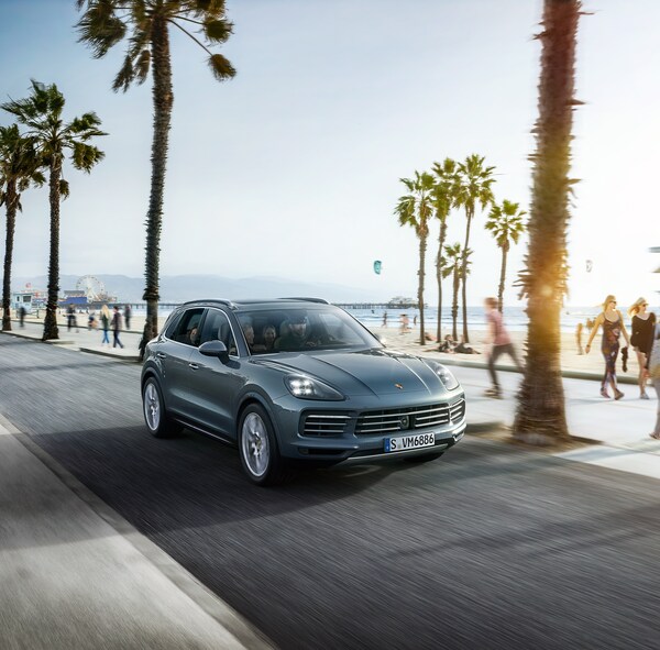 2019-Porsche-Cayenne-Base-SUV.png blue grey Porsche Cayenne driving down a California beach road