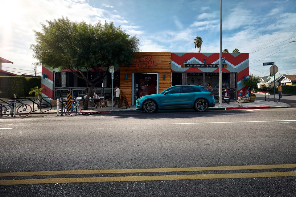 2020-Porsche-Macan-S-SUV-L08.png bright blue Porsche Macan parked in front of Spicy Bowl restaurant