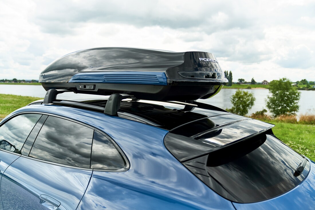 blue Porsche rooftop cargo carrier